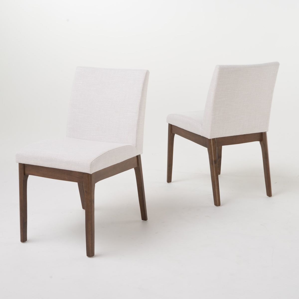 Nakuru white upholstered dining chairs set of two angled view on white background
