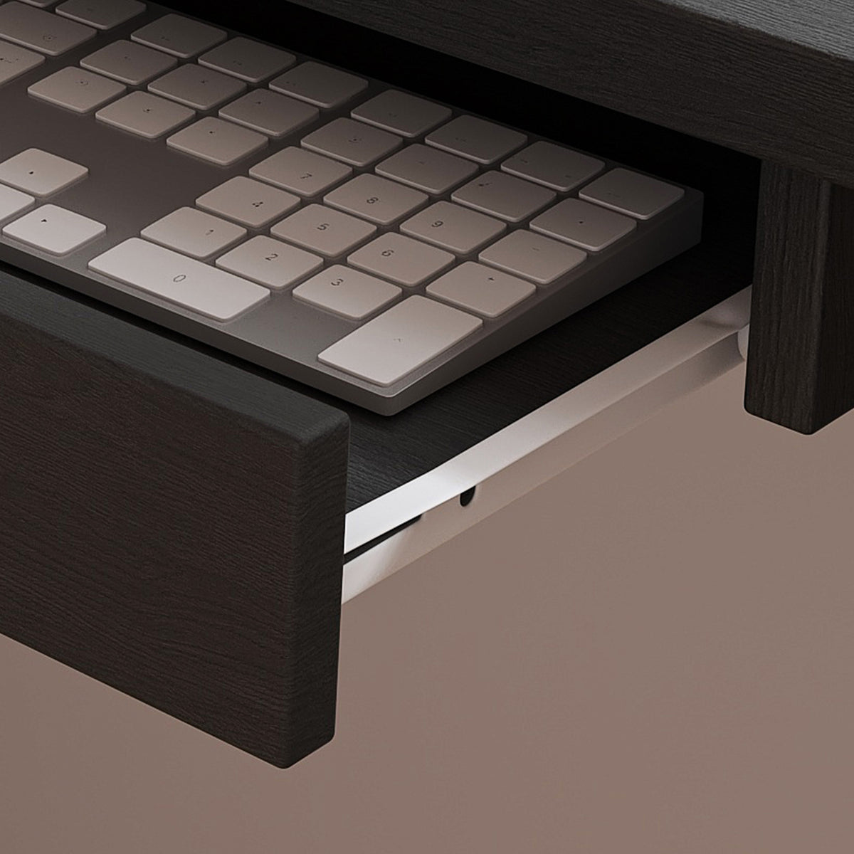Nord black computer desk showing pull-out storage drawer detail