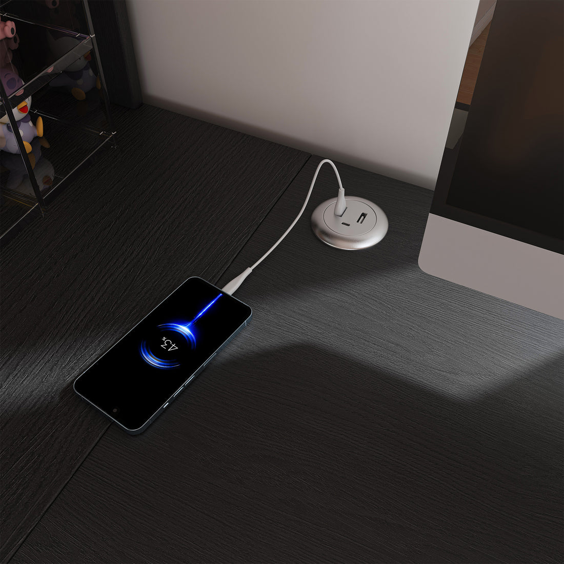 Nord black computer desk showing built-in power outlet and USB charging detail