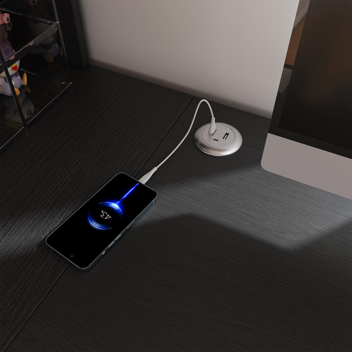 Nord black computer desk showing built-in power outlet and USB charging detail