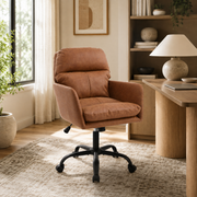 Norven brown faux leather swivel office chair in a traditional home office with wood desk