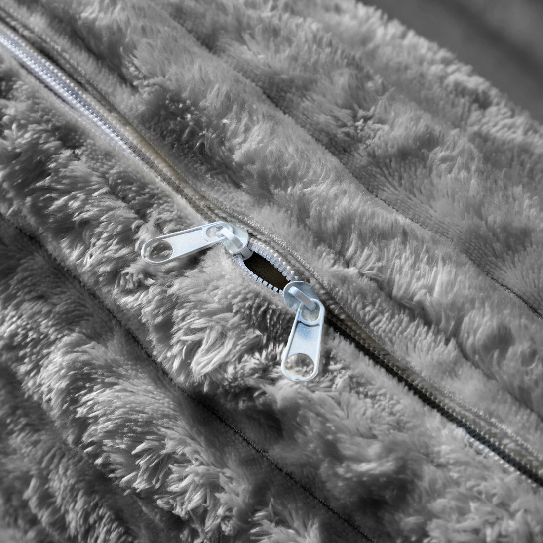 homycasa norwalk Close-up of a zipper on a textured gray fabric surface