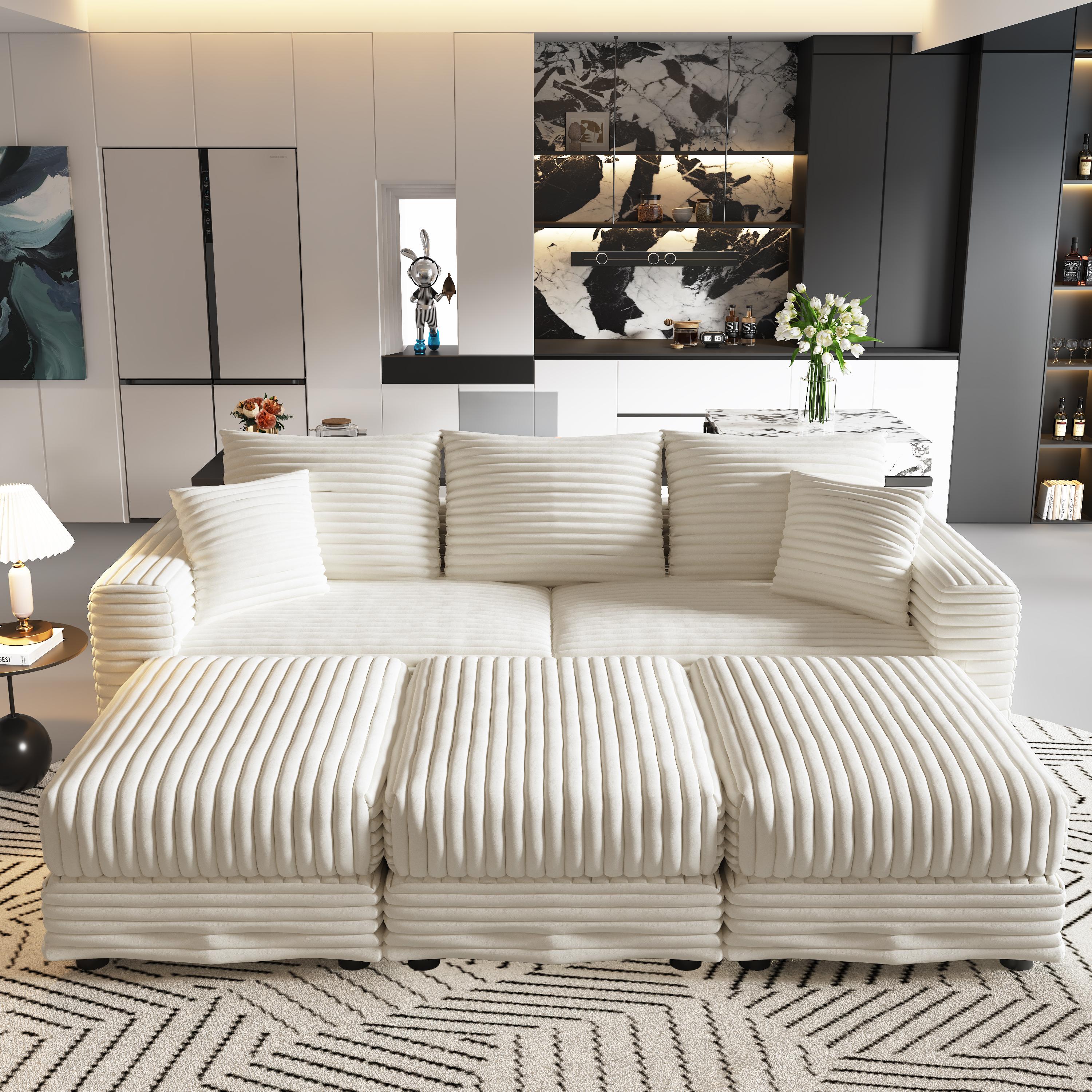 Norwalk beige sectional sofa showing lifestyle front view with modular ottoman layout