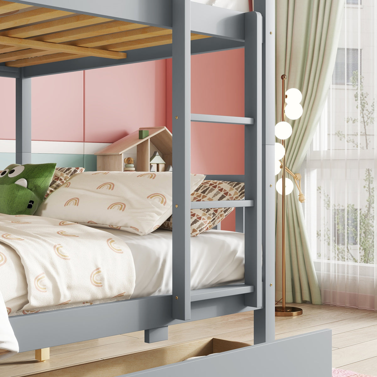 Orla gray full over full rubberwood bunk bed close-up of the front guardrail and bed frame construction