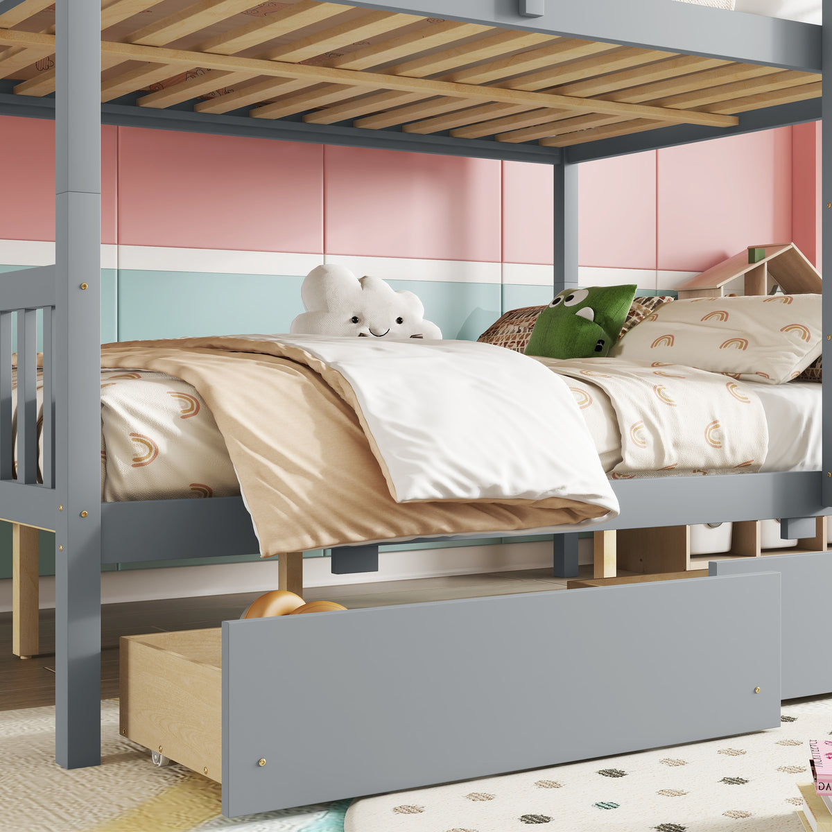 Orla gray full over full rubberwood bunk bed close-up of the lower bunk and rolling storage drawer
