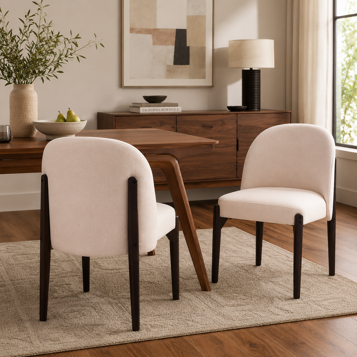 Orta beige upholstered dining chairs around a wood table in a warm contemporary dining room