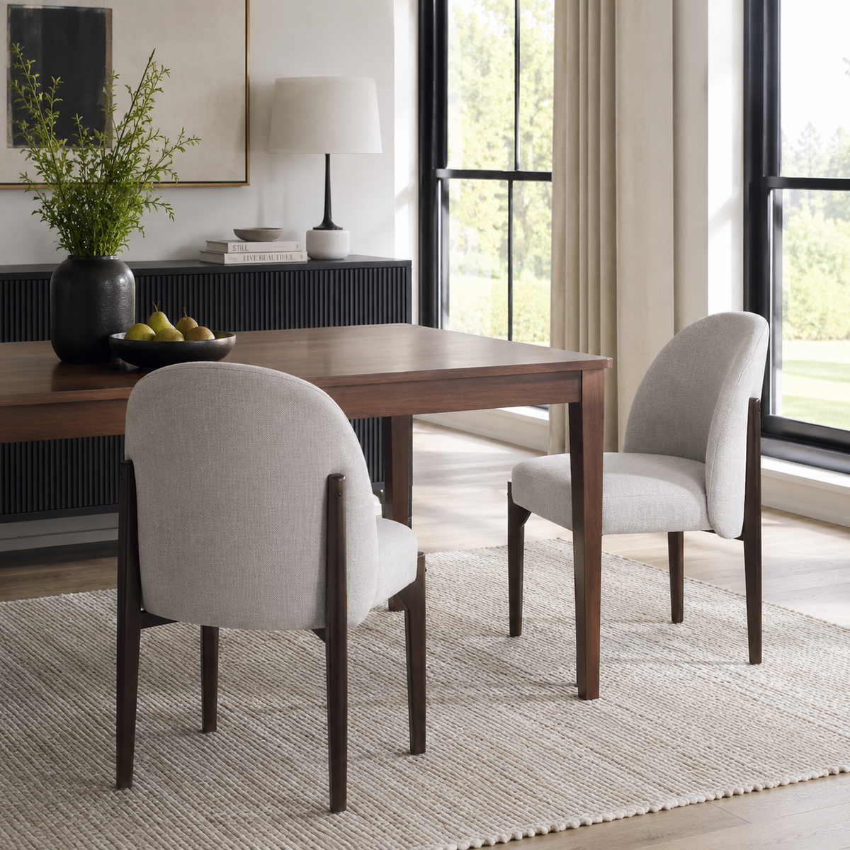 Orta gray barrel back dining chairs beside a table in a cozy contemporary room