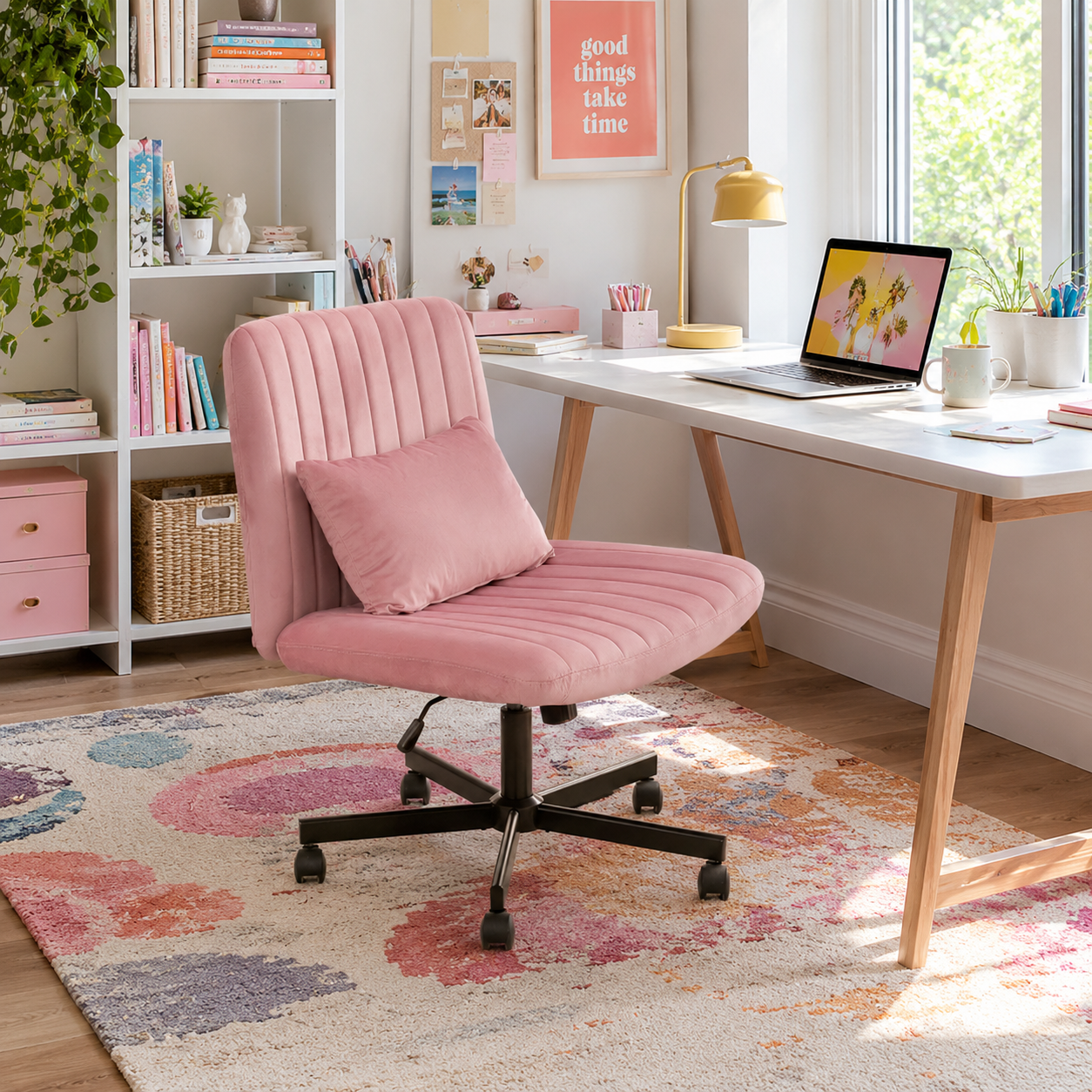 Ovina pink wide seat office chair in a bright room with wall art and wood flooring