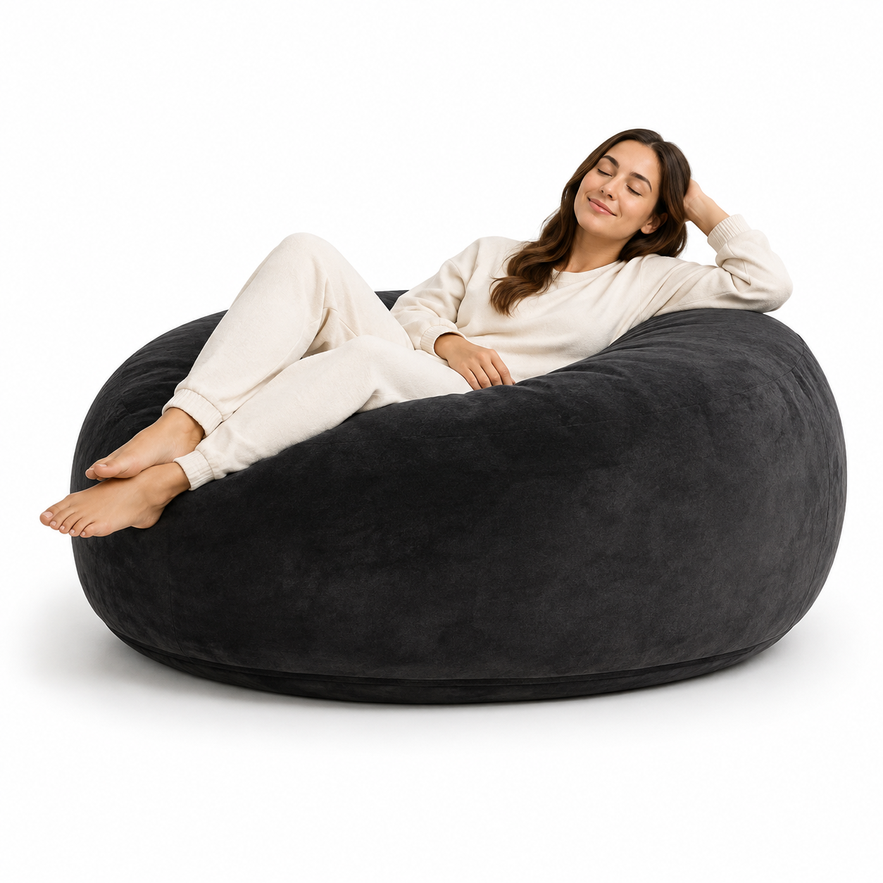 Pebble black bean bag chair showing a reclining woman against a clean white background