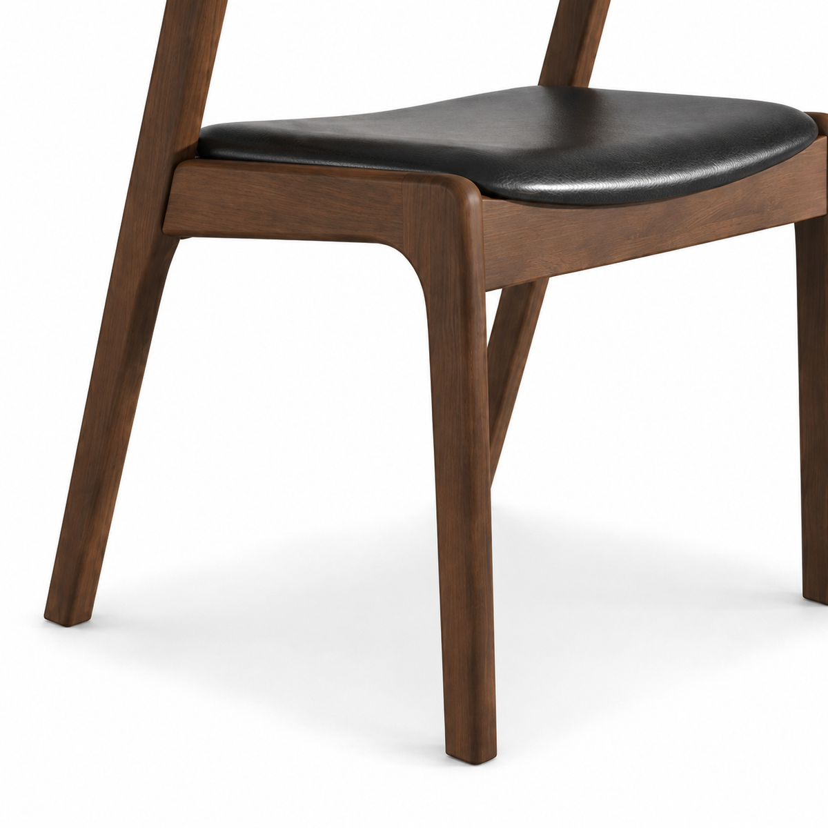 Peipus walnut dining chair close-up of the tapered solid wood leg and upholstered seat frame