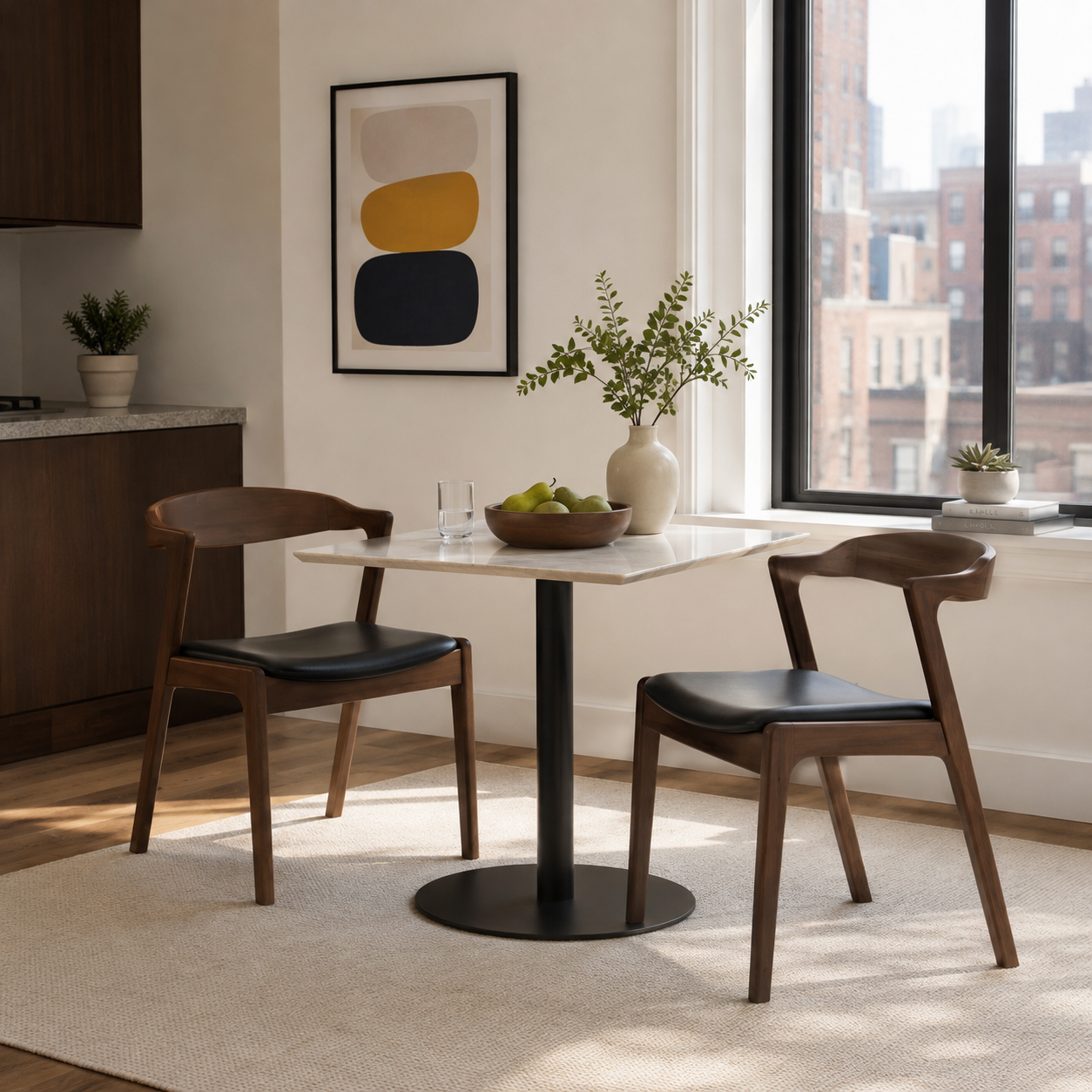 Peipus walnut solid wood dining chairs with black faux leather seats beside a round pedestal table