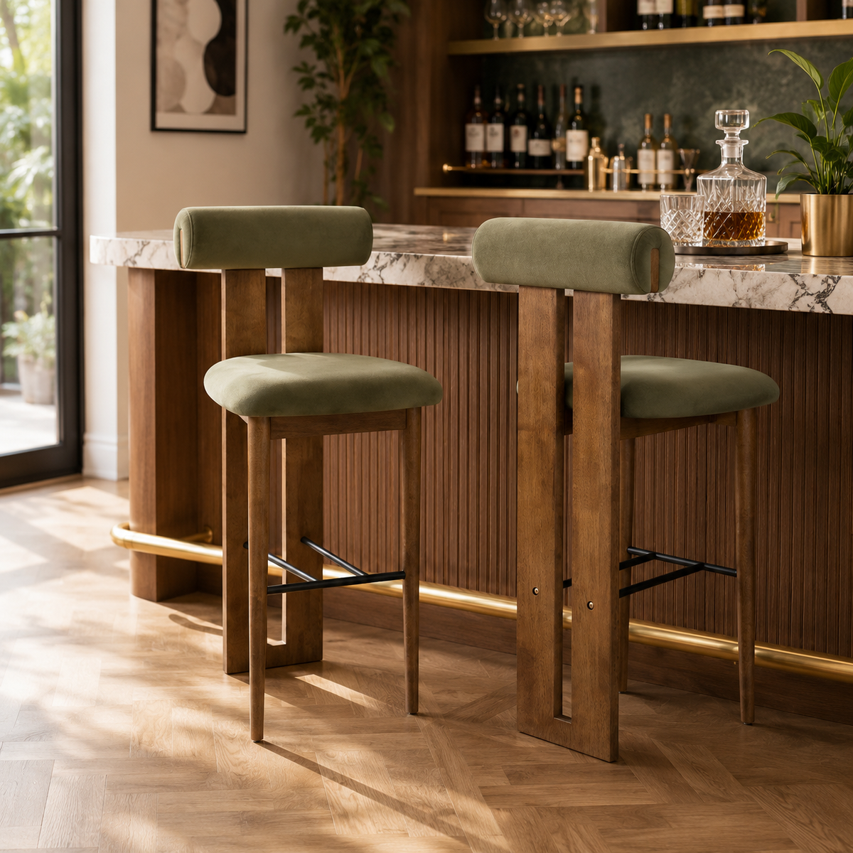 Pienza green upholstered bar stools in a warm kitchen setting