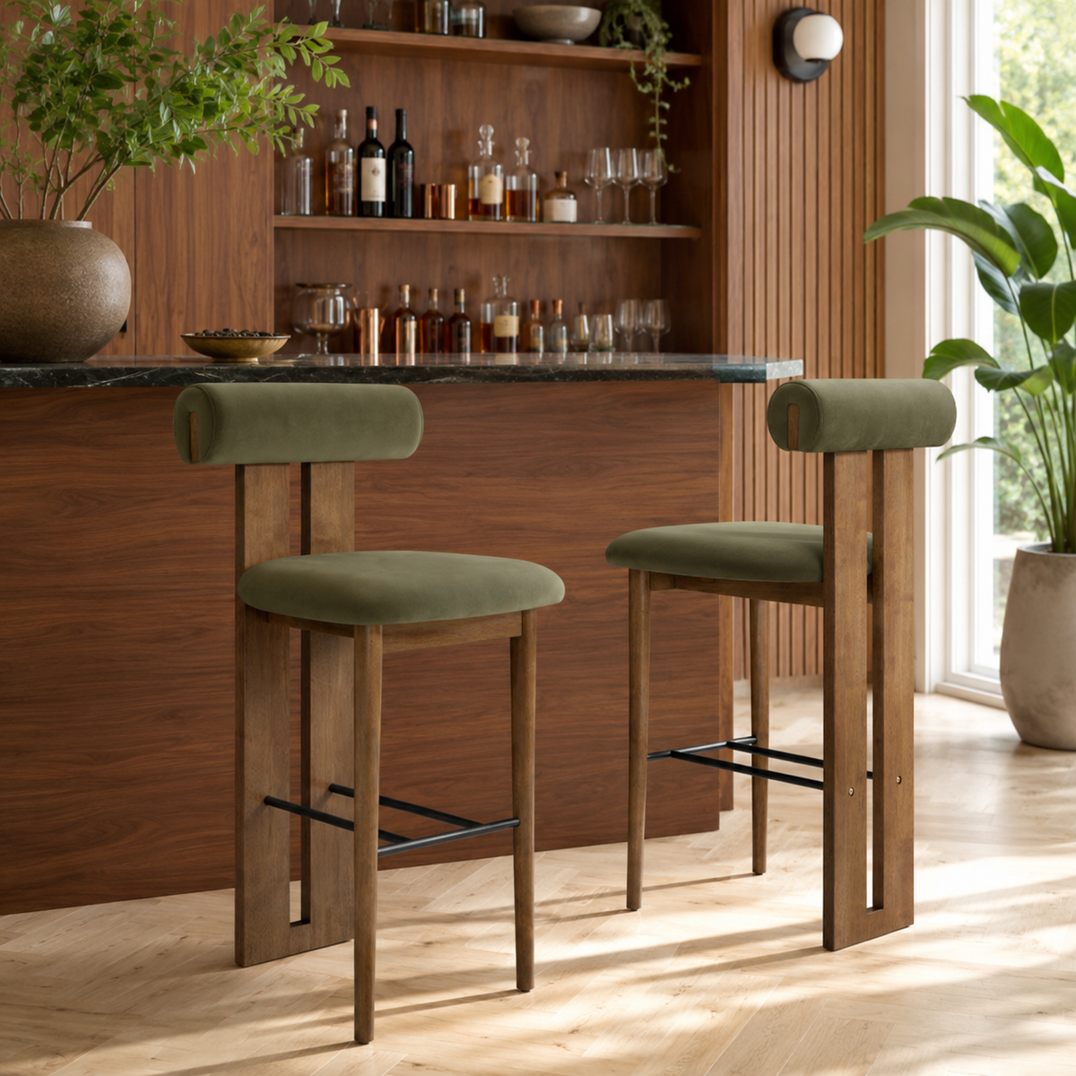 Pienza green upholstered bar stools in a warm kitchen setting