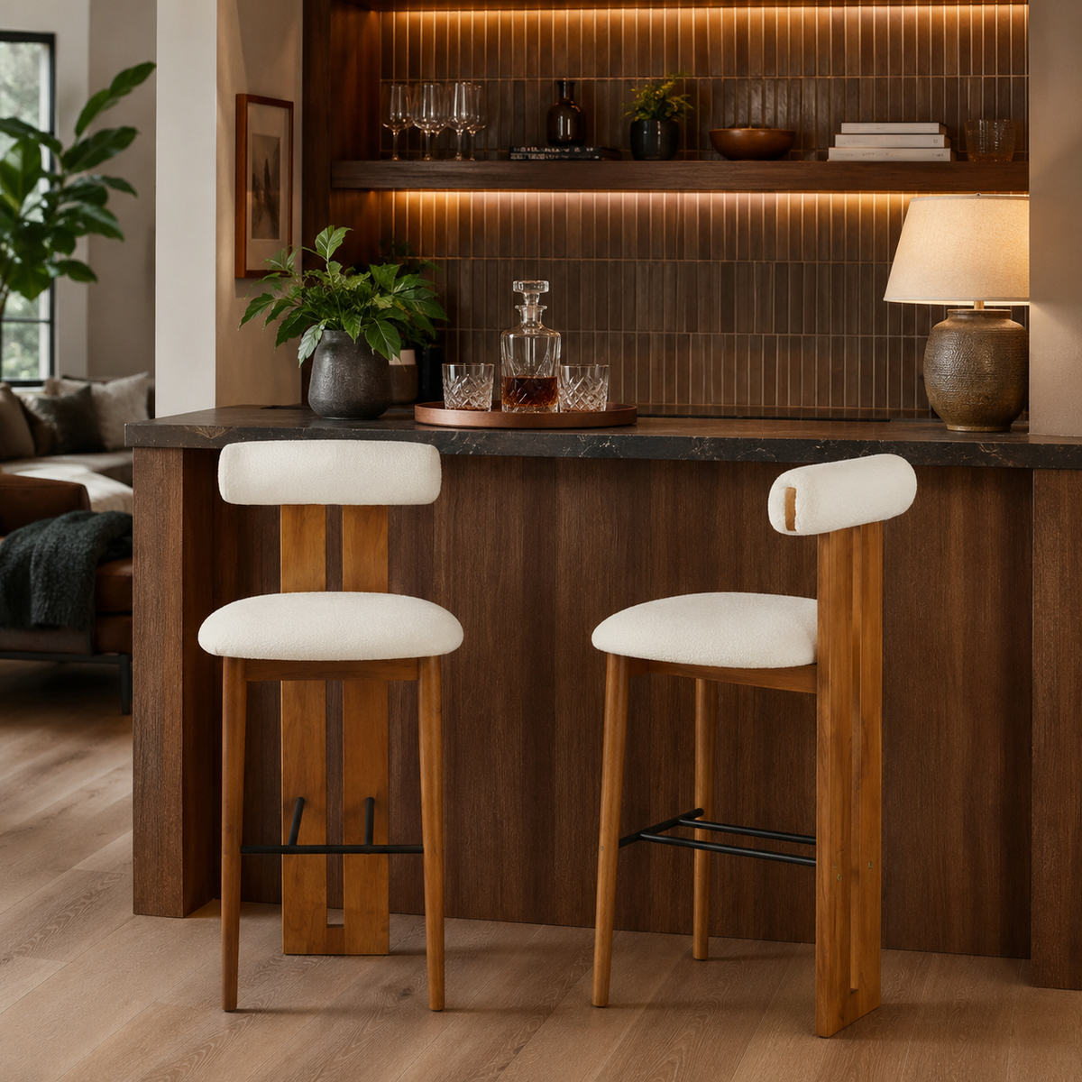 Pienza white upholstered bar stools tucked under a kitchen island