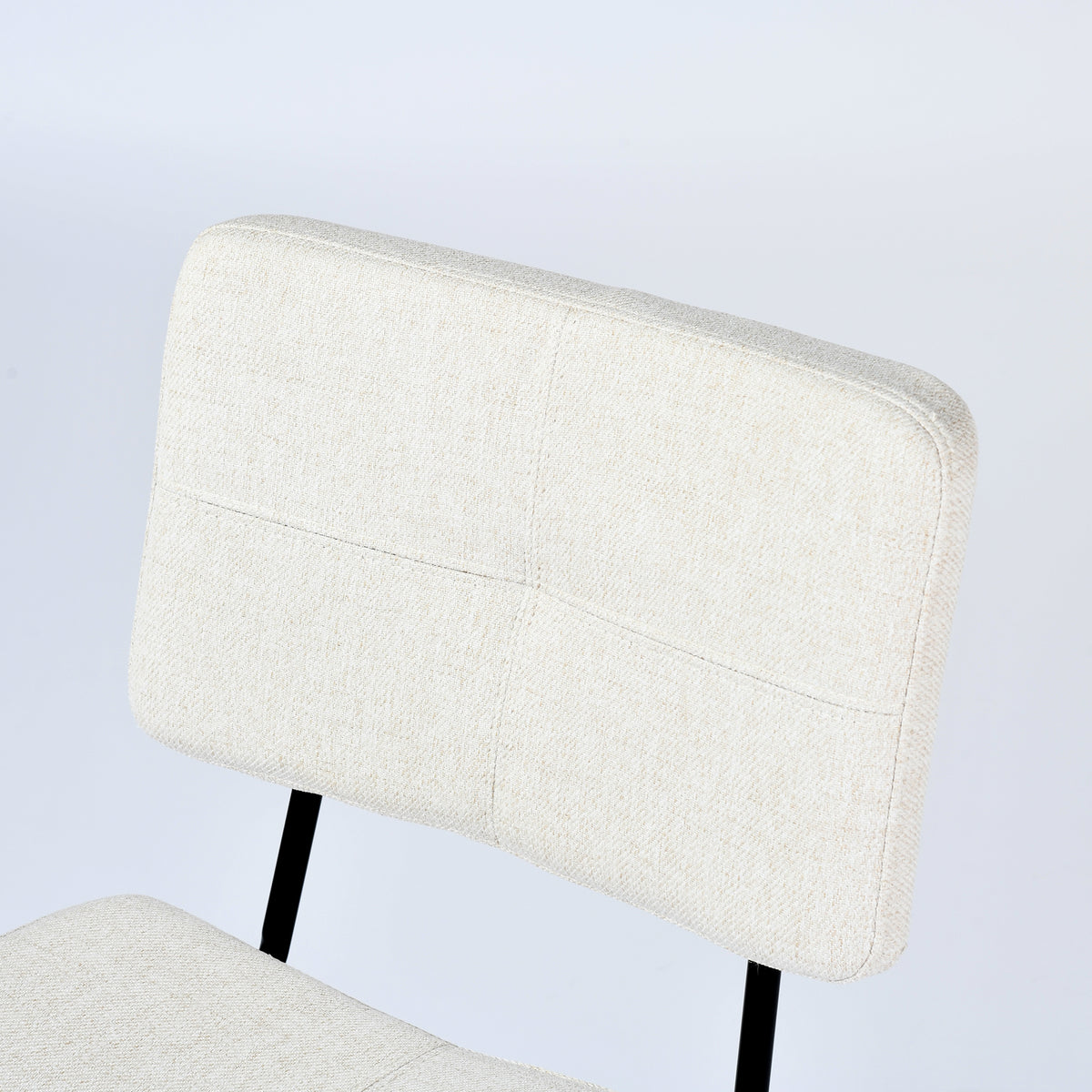 Pomona beige upholstered dining chair showing backrest fabric detail