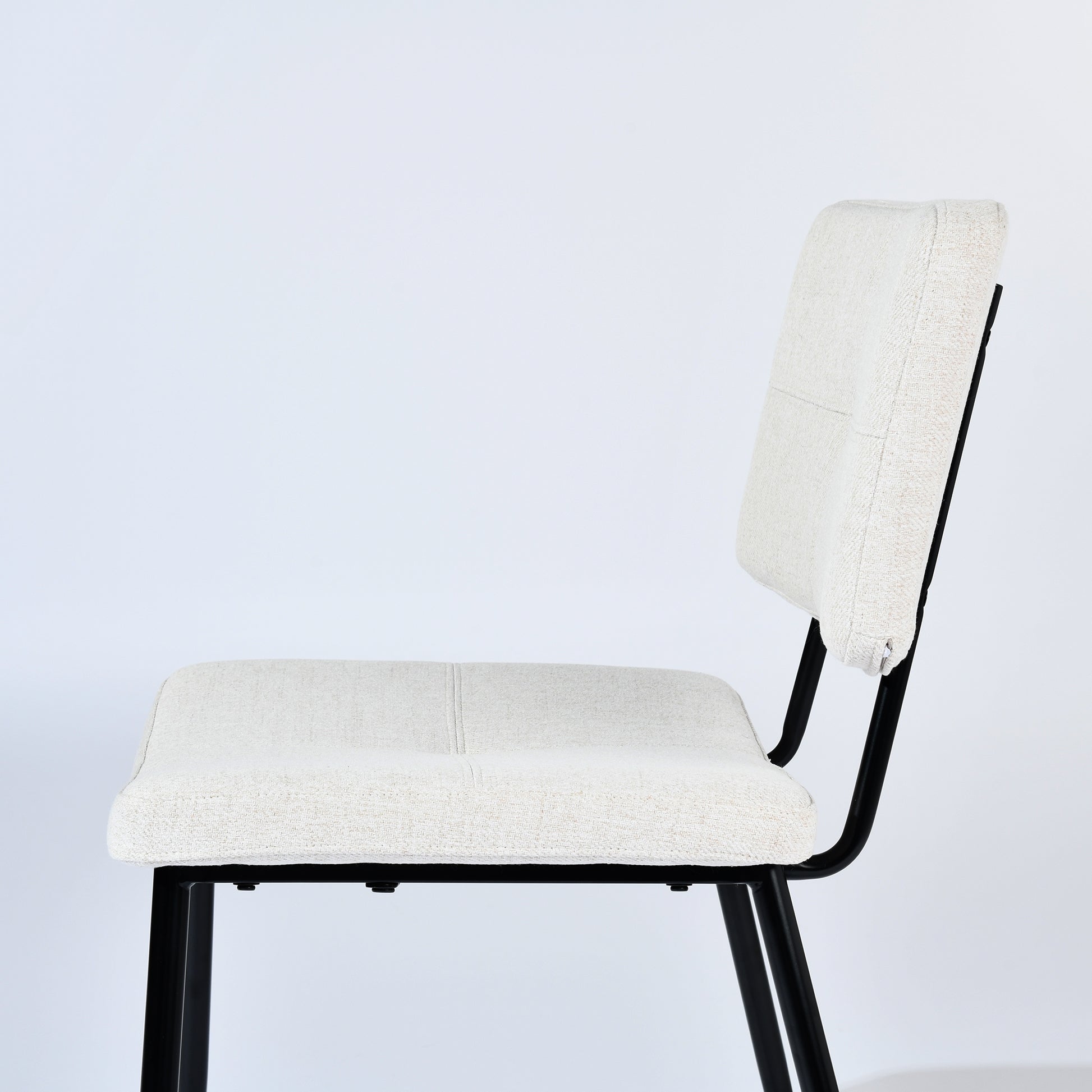 Pomona beige upholstered dining chair showing side frame