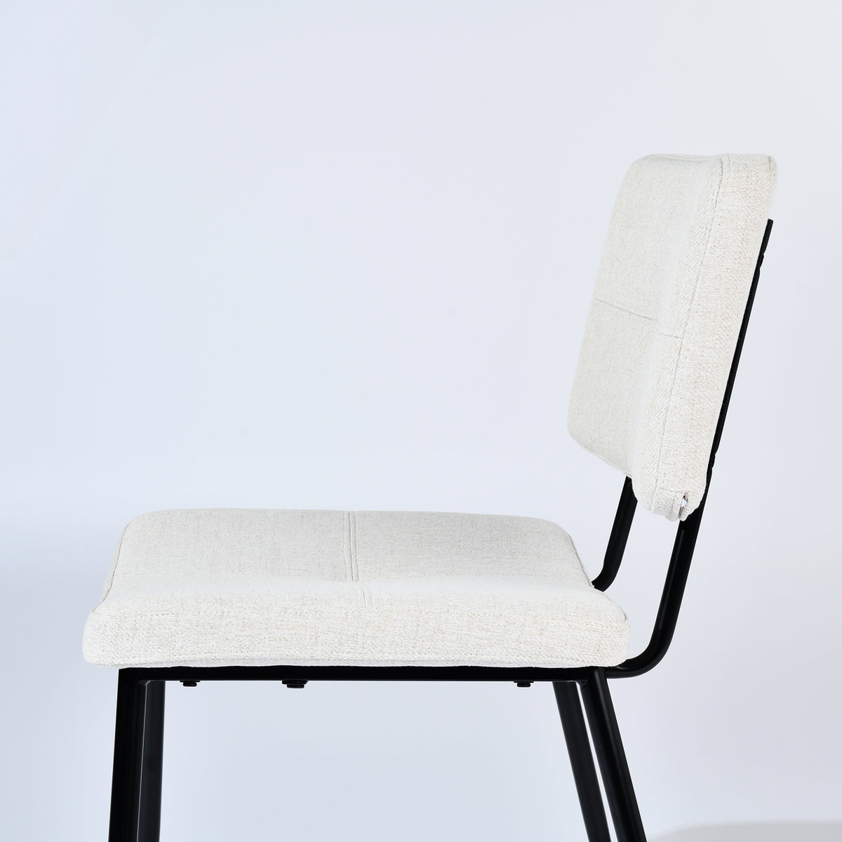 Pomona beige upholstered dining chair showing side frame