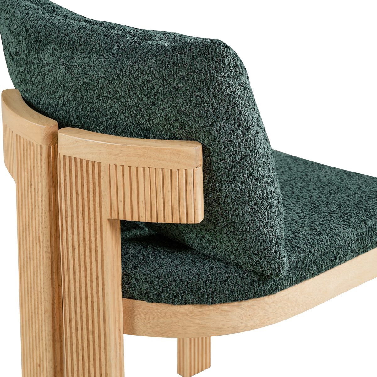 Pukaki green dining chair close-up of the loose boucle back cushion and fluted wood support