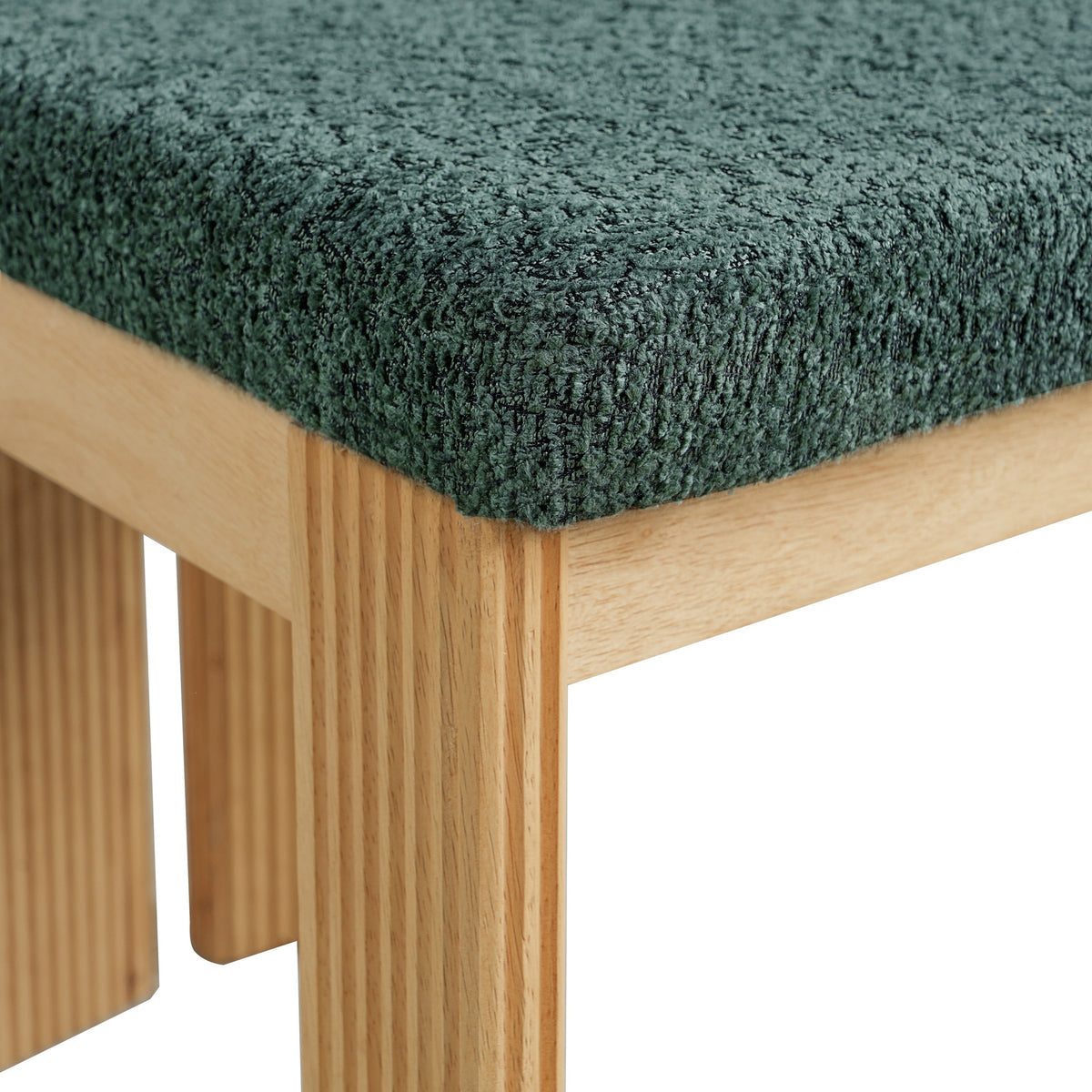Pukaki green dining chair close-up of the textured boucle seat and solid wood frame