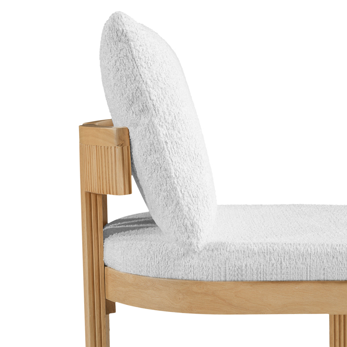 Pukaki white dining chair close-up of the boucle upholstered back cushion and wood frame