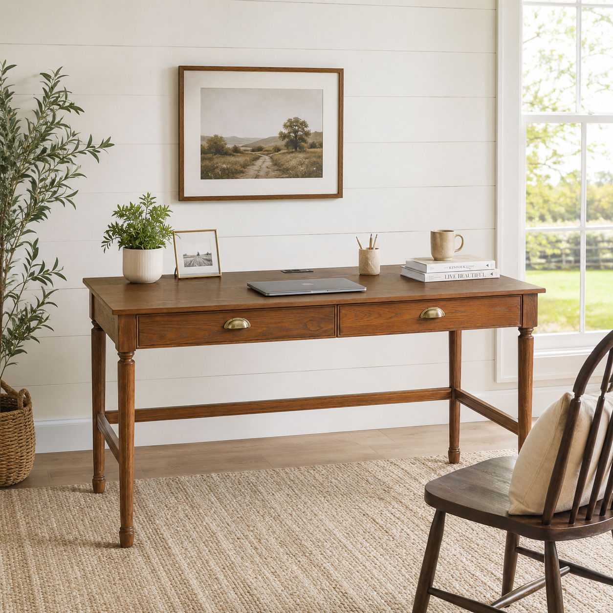 Pulse walnut writing desk showing two drawers in a bright room with shelving and framed artwork