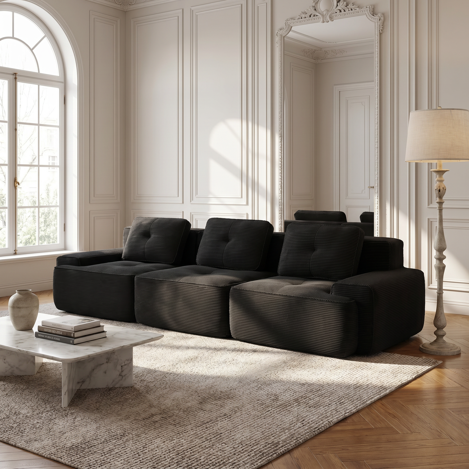 Racine black modular sofa showing angled living room view with modular ottomans