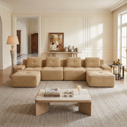 Racine light camel modular sofa showing front living room setup with two ottomans