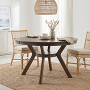 Rainier oak dining table showing a styled dining room scene with woven chairs