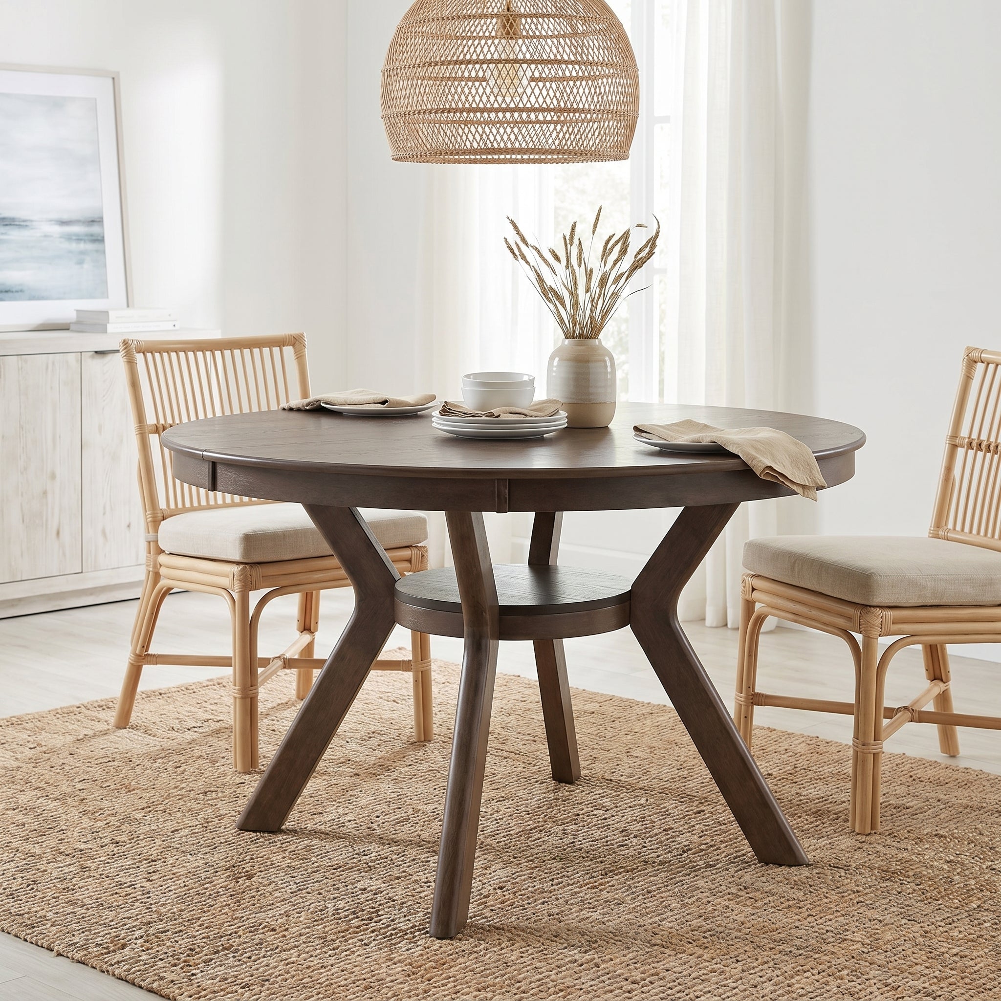 Rainier oak dining table showing a styled dining room scene with woven chairs