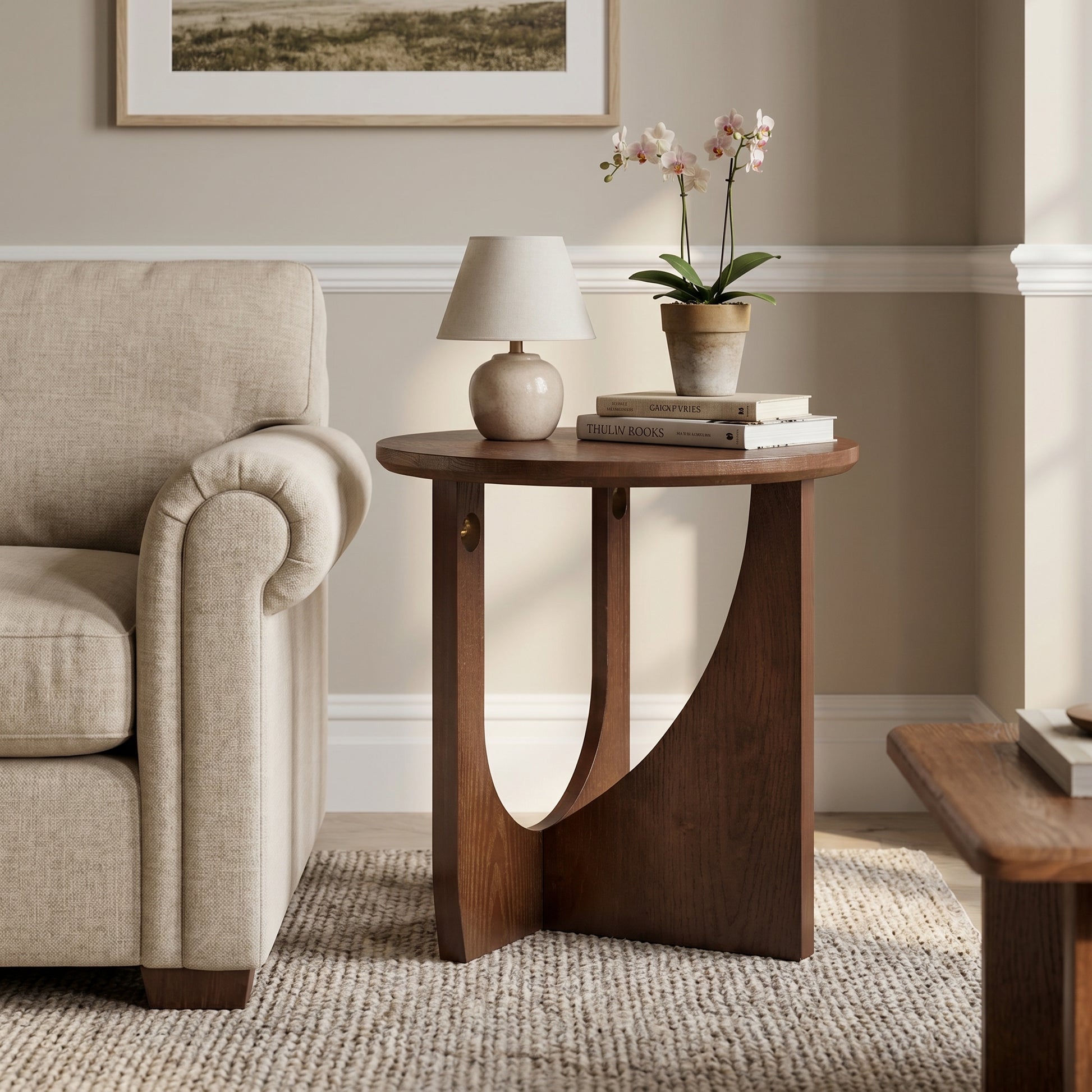 Ravon walnut end table showing front view beside a sofa