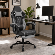 Rigel black ergonomic gaming chair with lumbar cushion and footrest in a modern home office