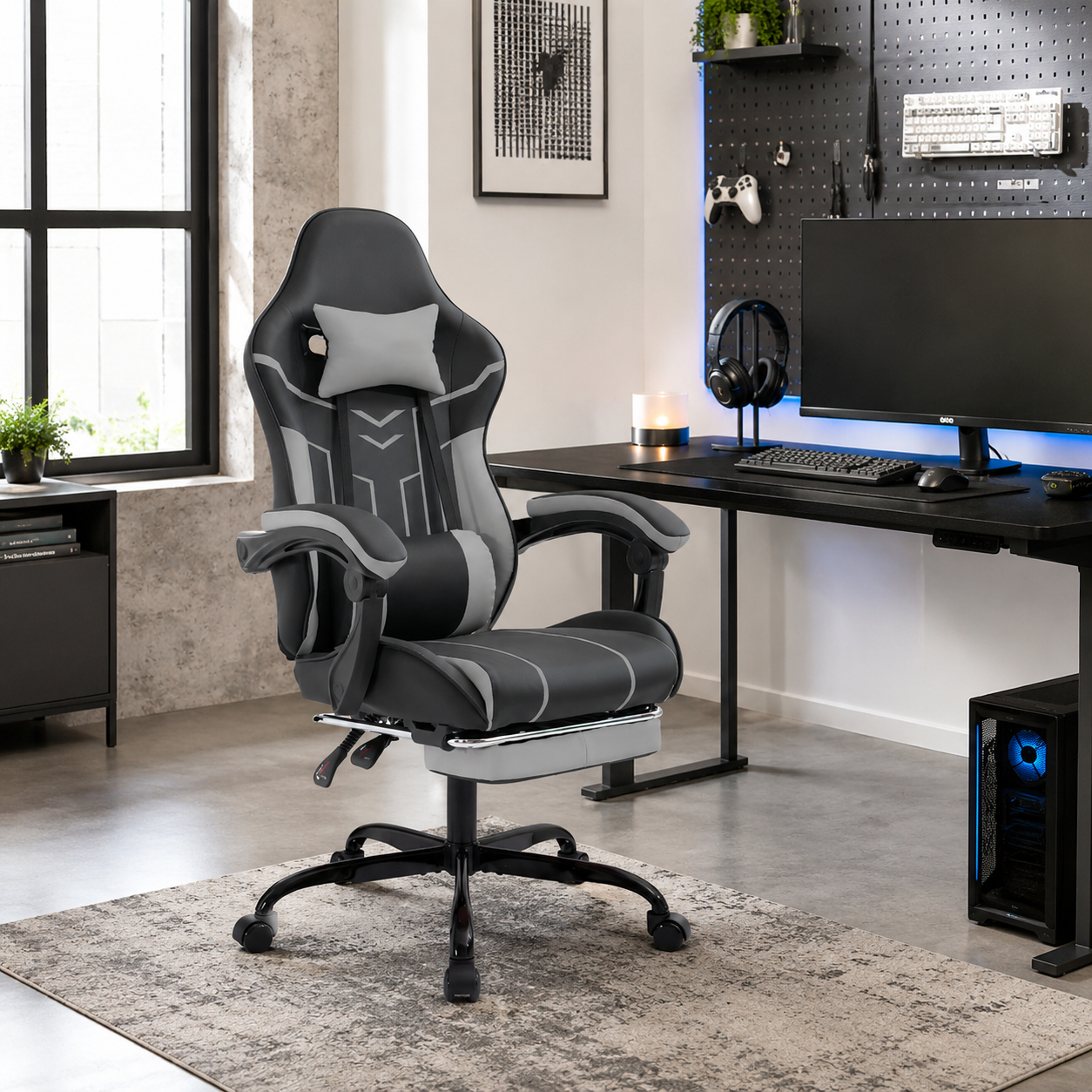 Rigel black gaming chair with padded armrests in a bright gaming workspace