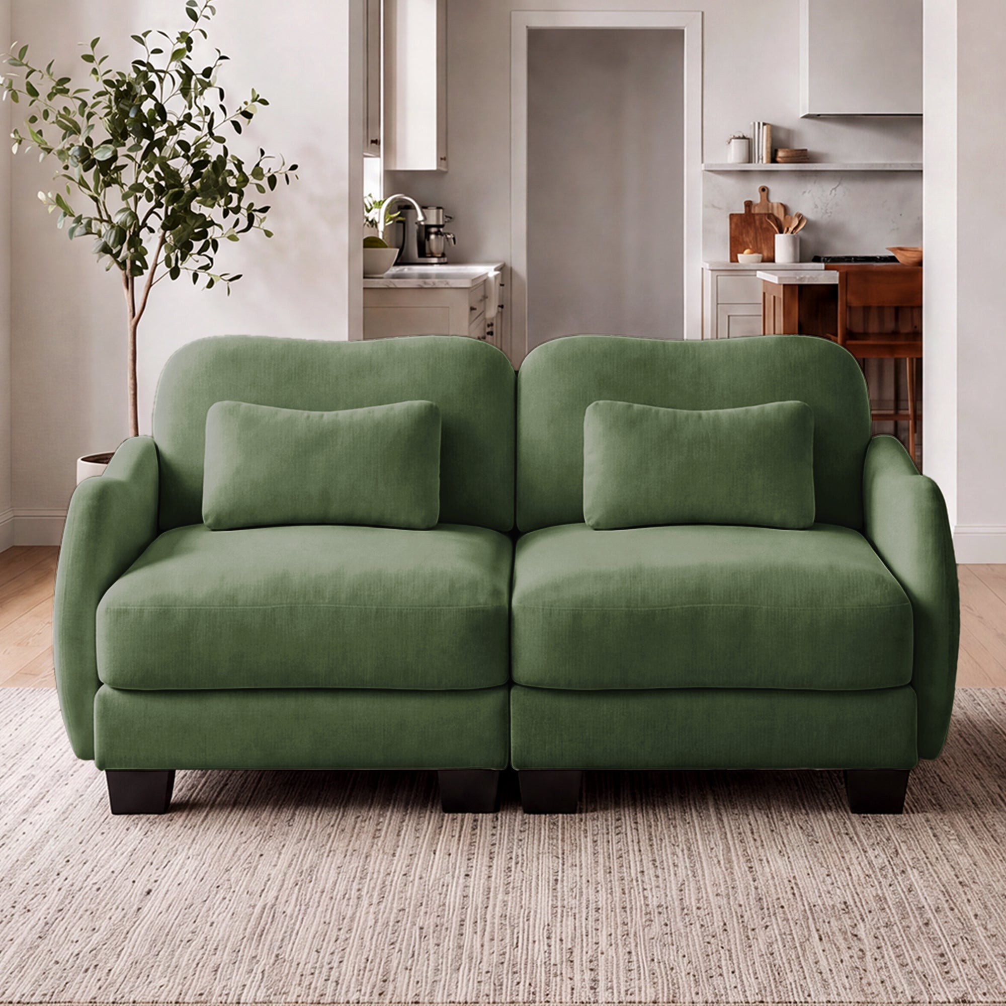 Rosedale green loveseat sofa showing angled front view in a living room