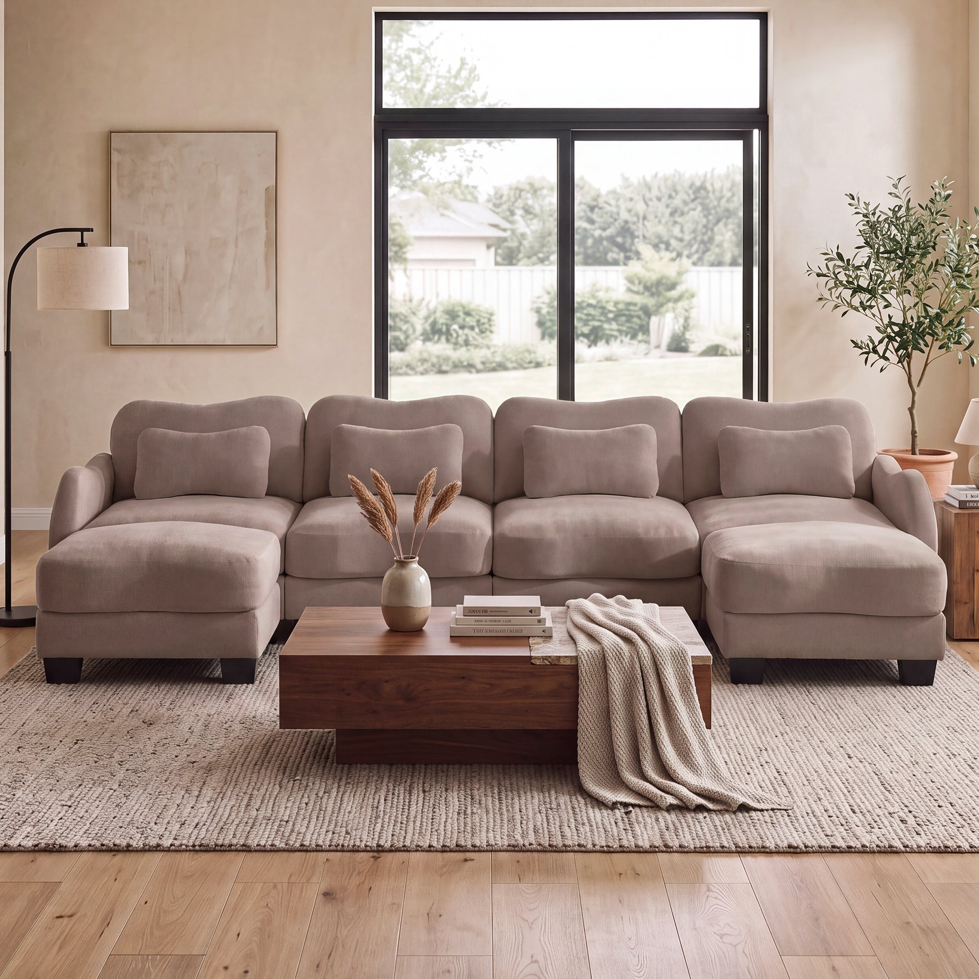 Rosedale brown gray sectional sofa shown in a bright living room with a wood coffee table and large windows