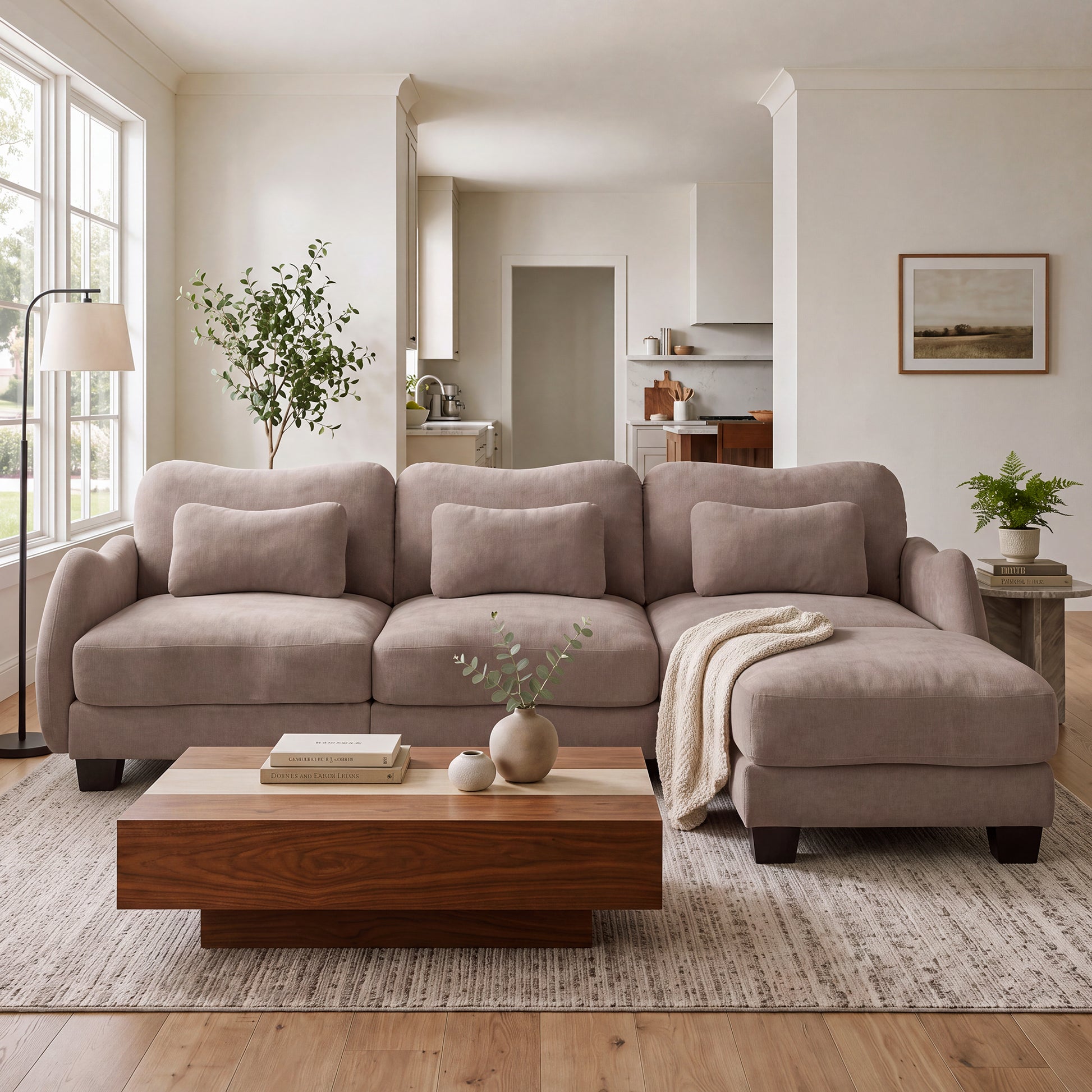 Rosedale brown gray sectional sofa showing an L-shaped modular layout with ottoman in a bright living room