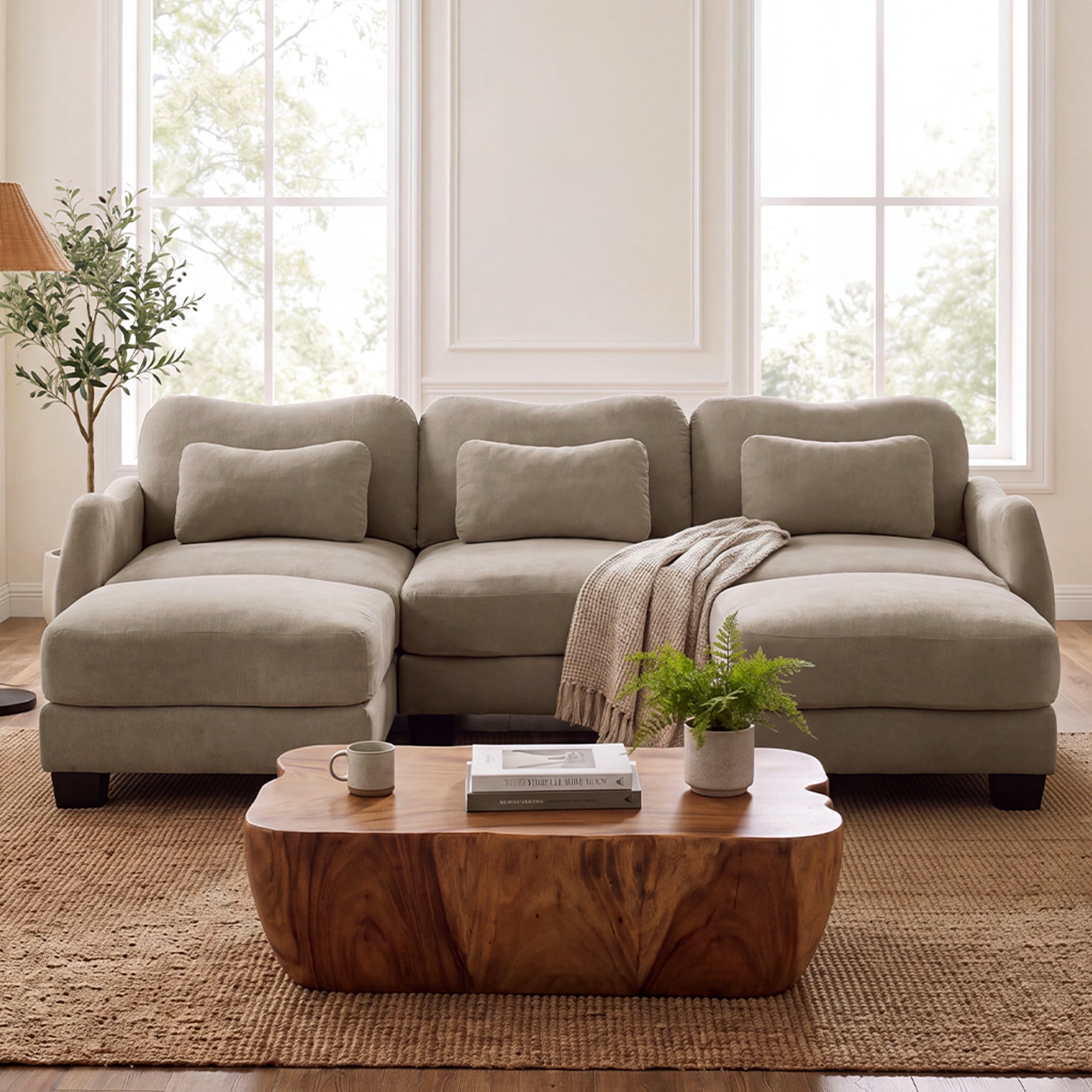 Rosedale brown sectional sofa showing a U-shaped modular layout with two ottomans and a wood coffee table