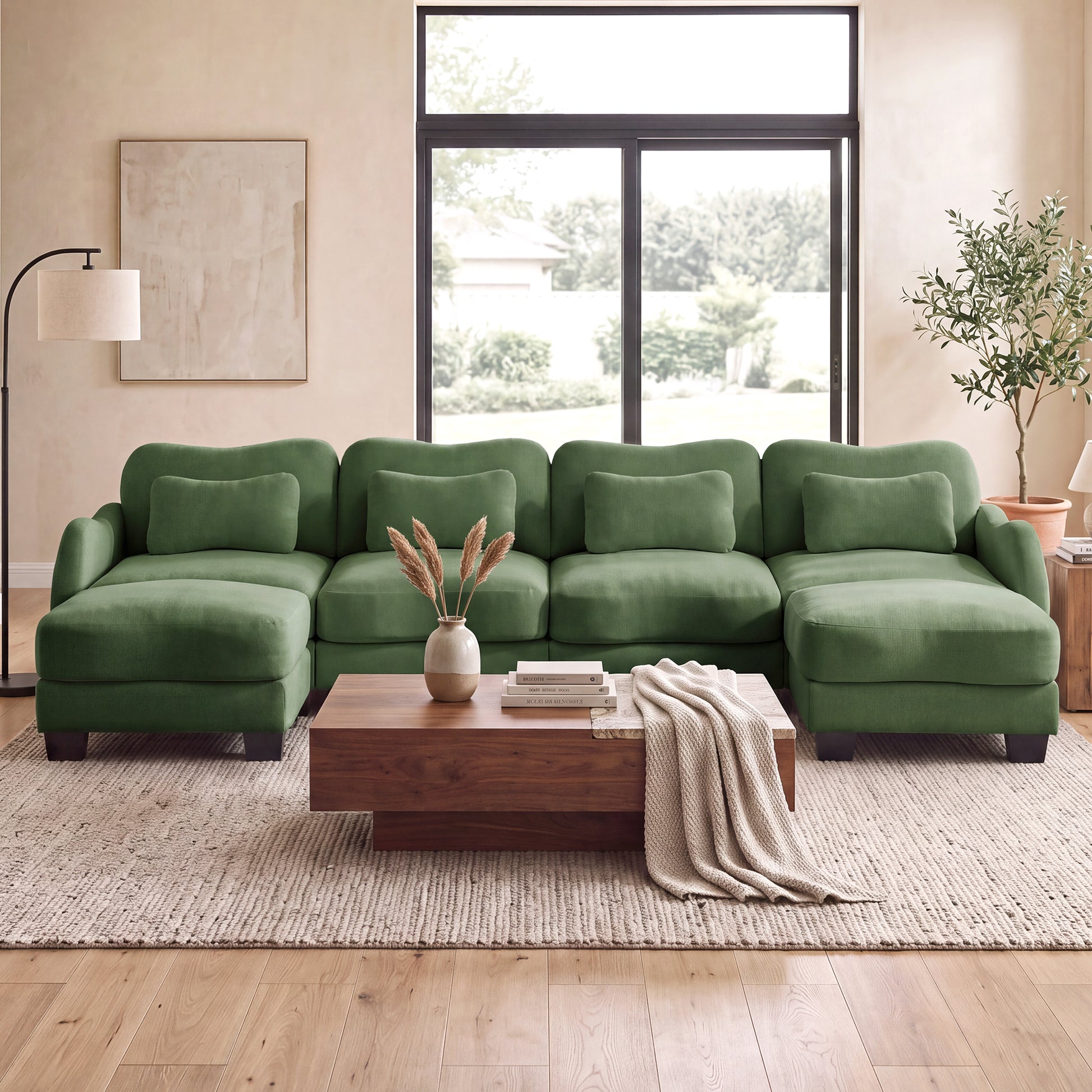 Rosedale green sectional sofa shown in a bright living room with a wood coffee table and large windows