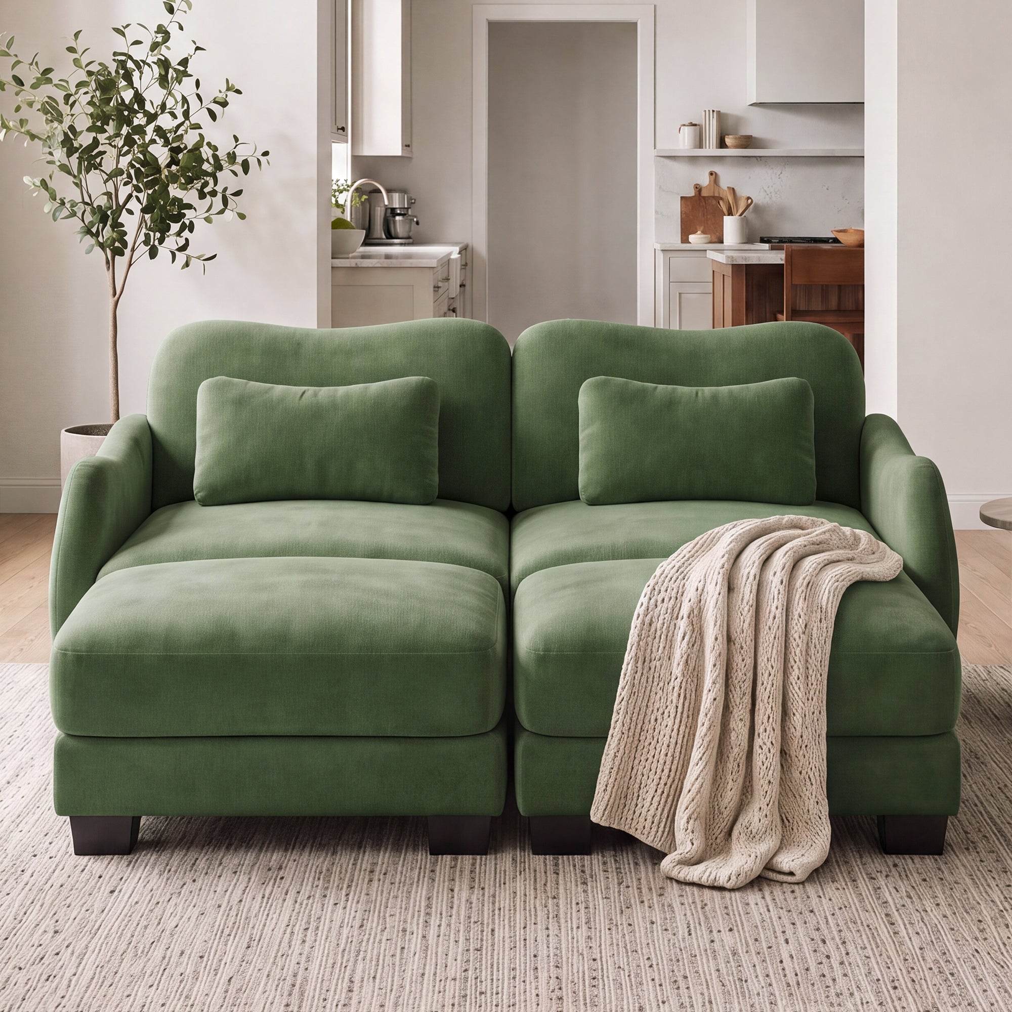 Rosedale green sectional sofa showing a four-piece modular layout with two ottomans in a bright living room