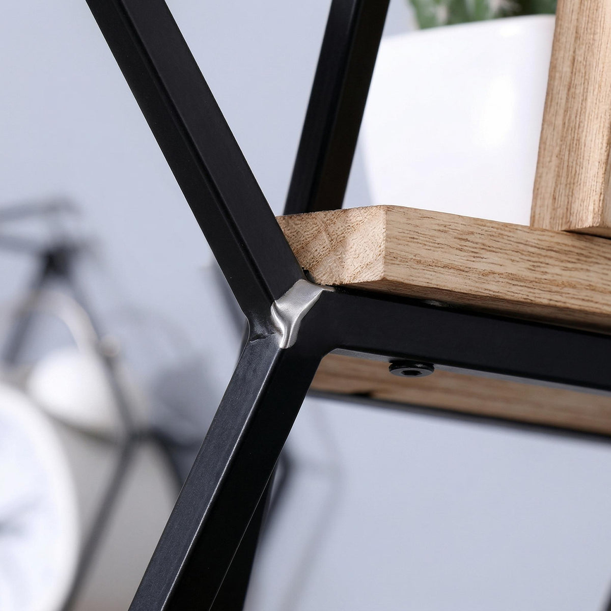 Sage natural floating shelves showing shelf underside and black metal mounting frame detail