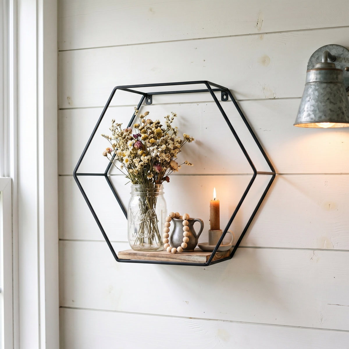 Sage natural floating shelves showing a hexagonal shelf with candle and decorative objects