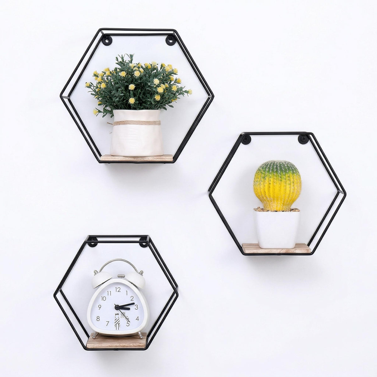 Sage natural floating shelves showing three hexagonal shelves isolated on white background