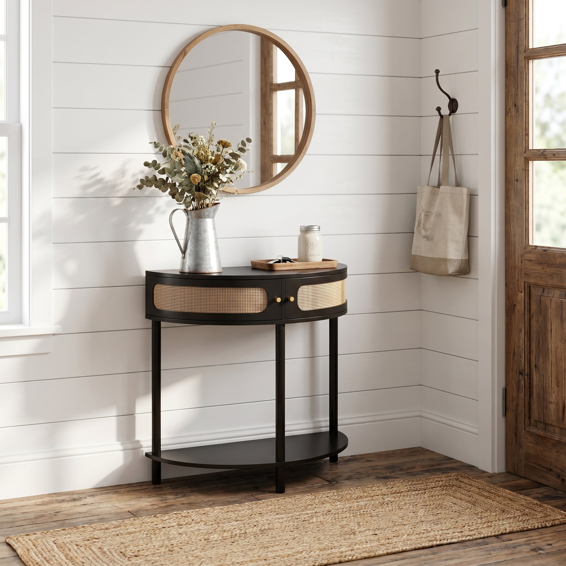 Saint black console table showing a styled corner scene with mirror and decorative accents