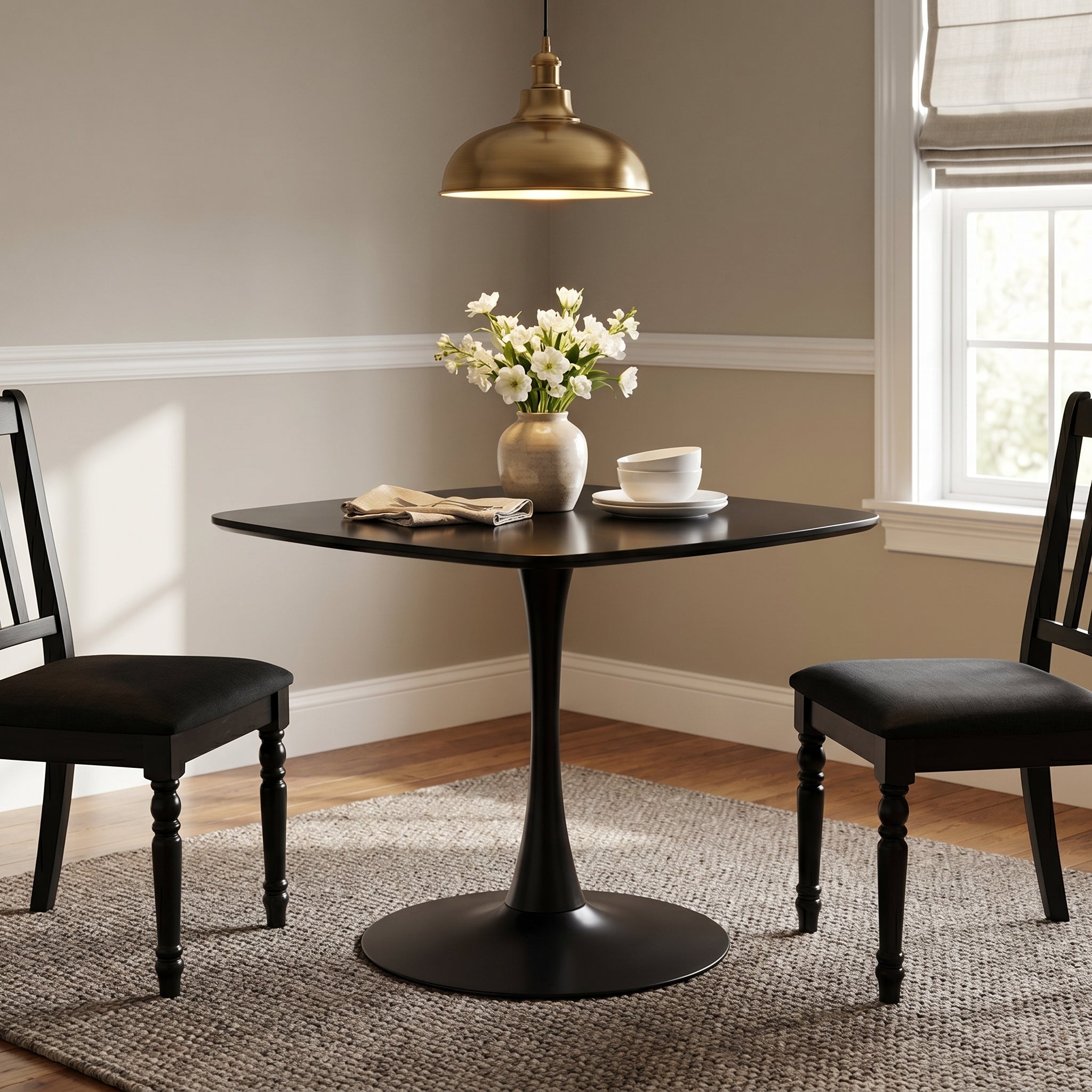 Santorini black dining table showing a modern dining setup with black chairs