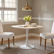 Santorini white dining table showing a square table in a bright dining nook