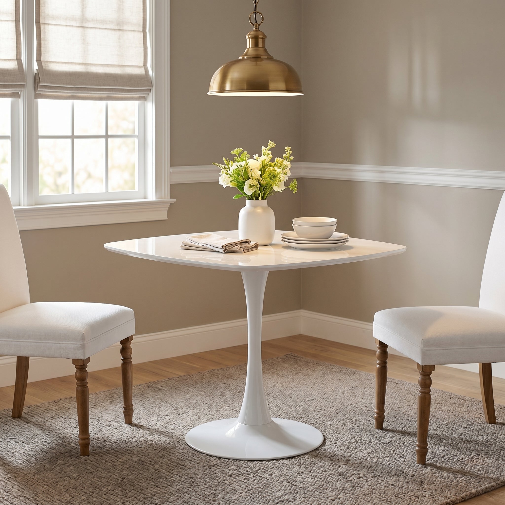Santorini white dining table showing a square table in a bright dining nook