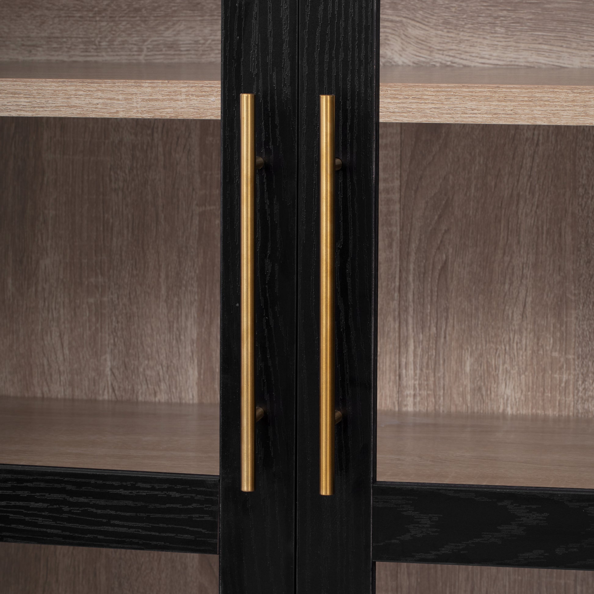 Savoy 71 inch black pantry cabinet close-up of brushed gold vertical handles and glass door frame detail