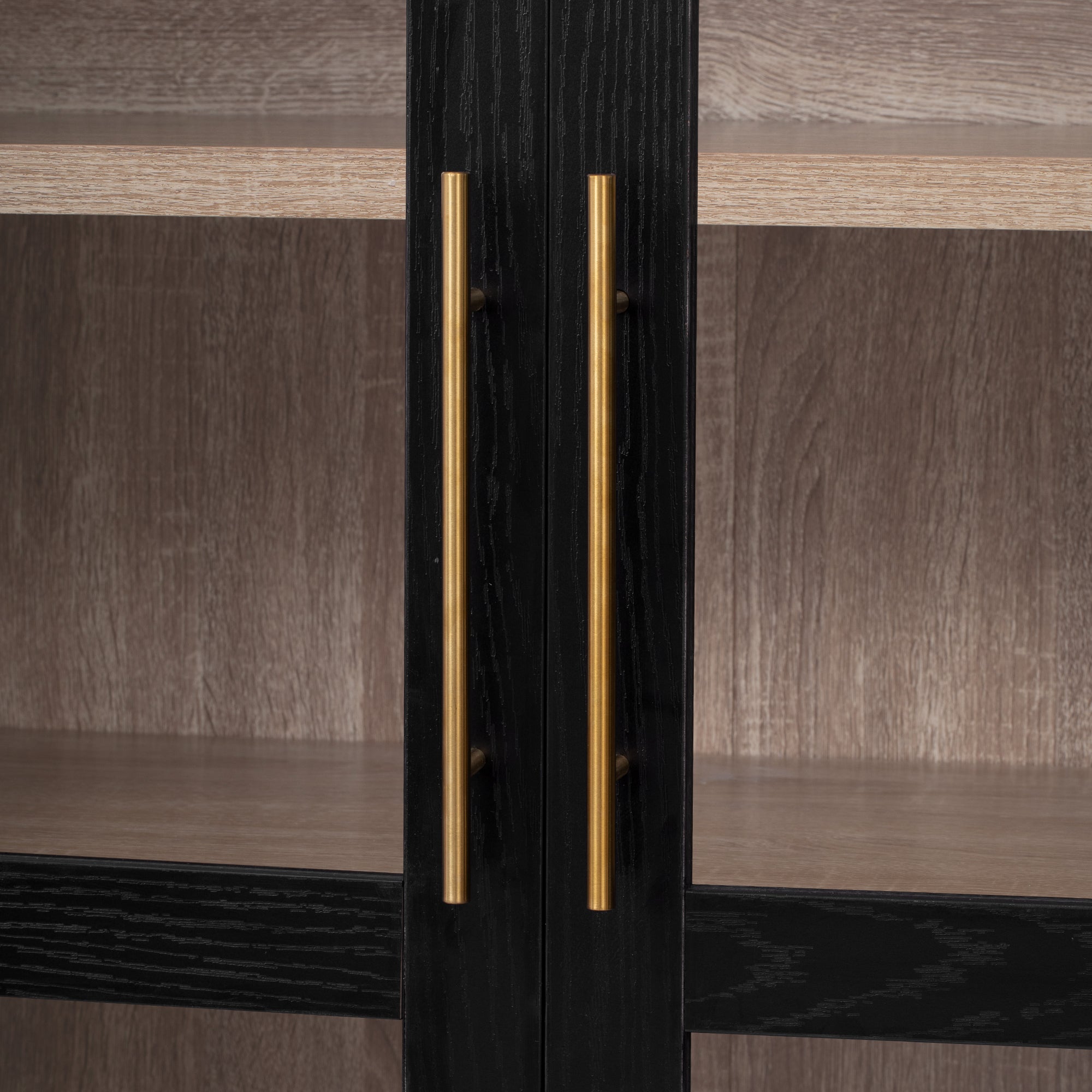 Savoy 71 inch black pantry cabinet close-up of brushed gold vertical handles and glass door frame detail