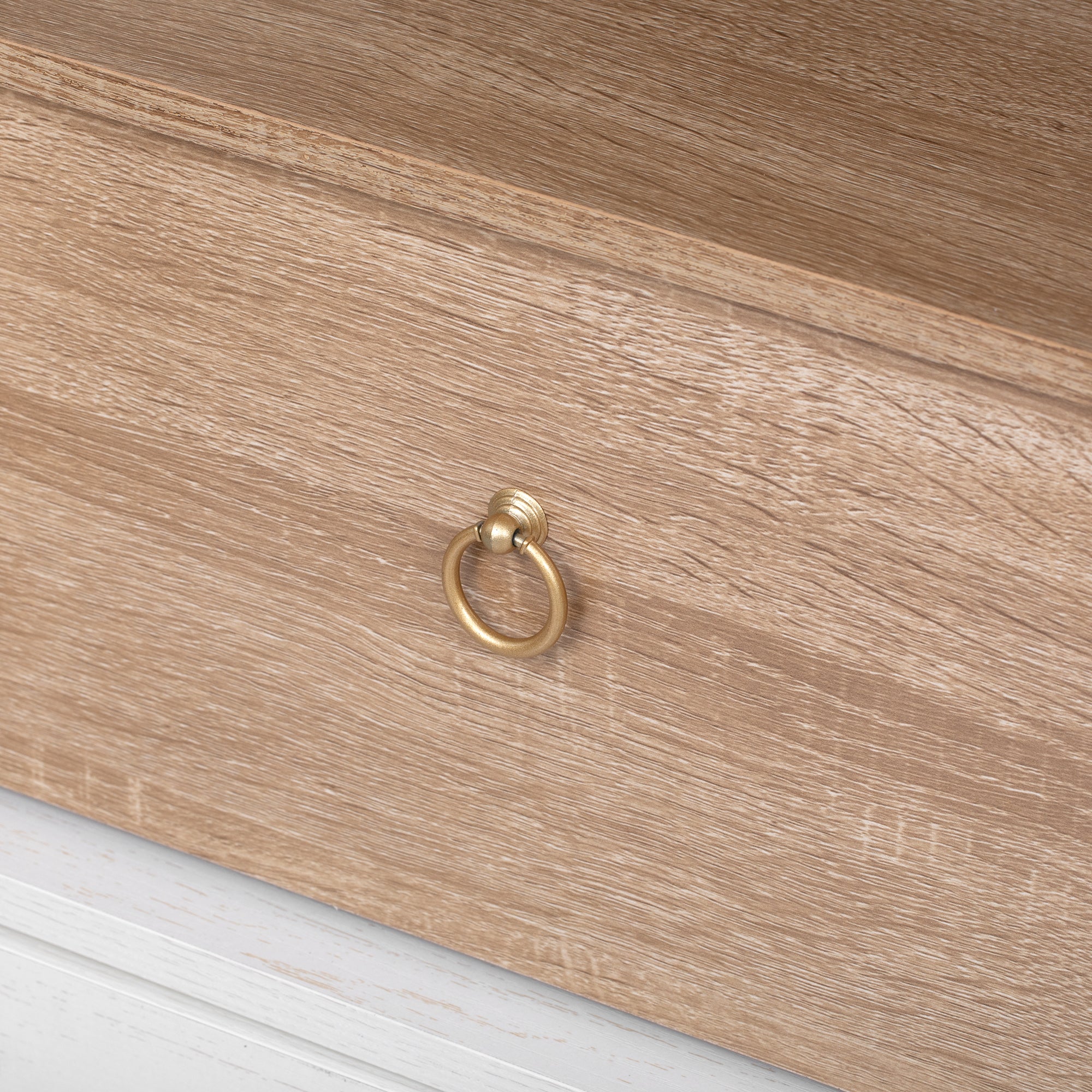 Savoy 71 inch pantry cabinet drawer front detail with antique gold ring pull handle and natural wood grain texture
