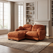 Seattle orange modular sofa styled in a bright modern living room with fireplace and soft natural lighting