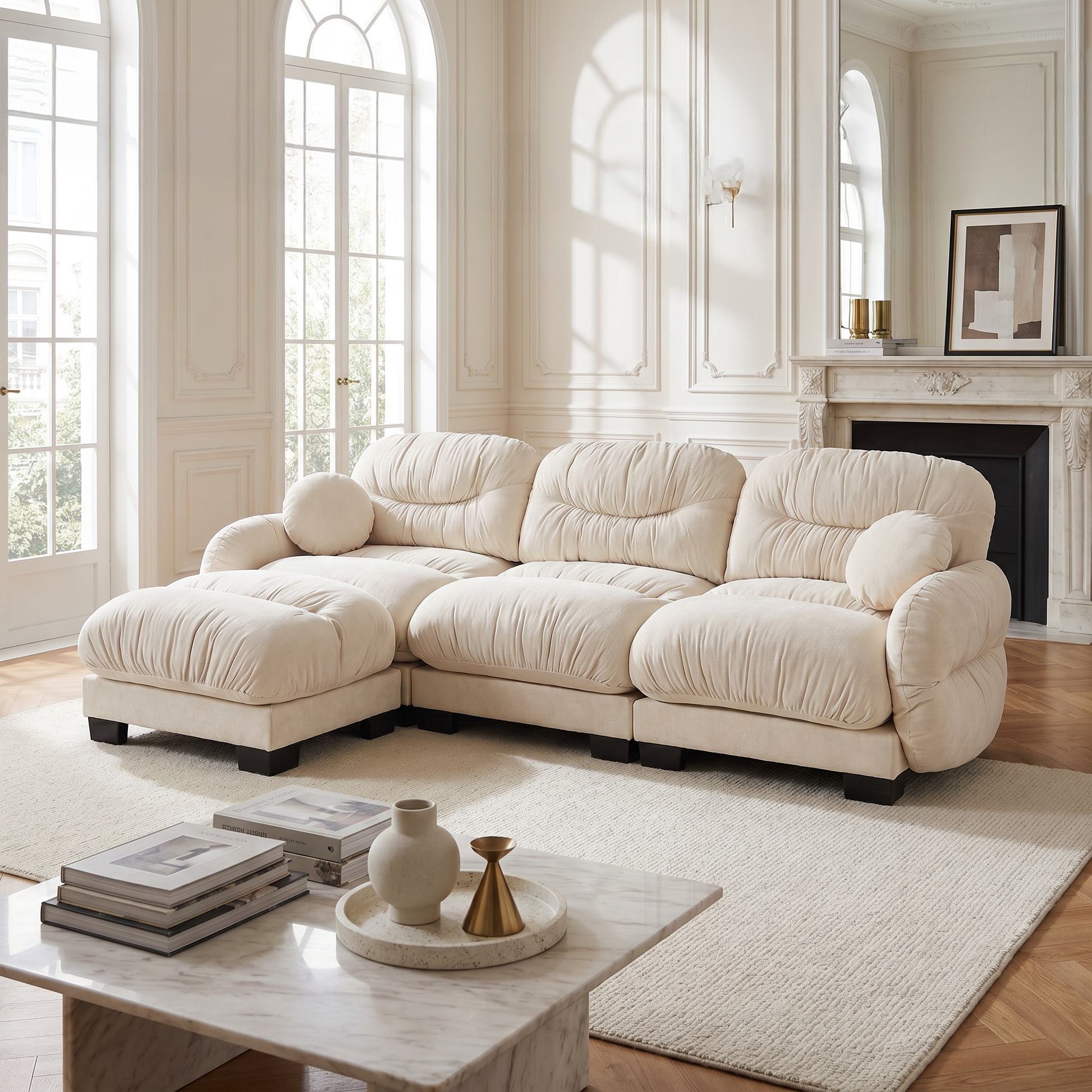 Beige chenille sectional sofa in a bright elegant lounge with tall windows and marble coffee table